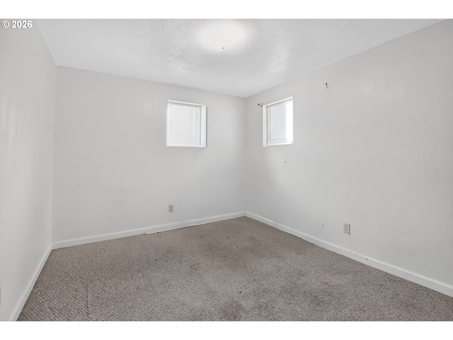 376 Northeast Chestnut Street Madras, OR 97741 - Photo 18 of 26 a view of an empty room with a window