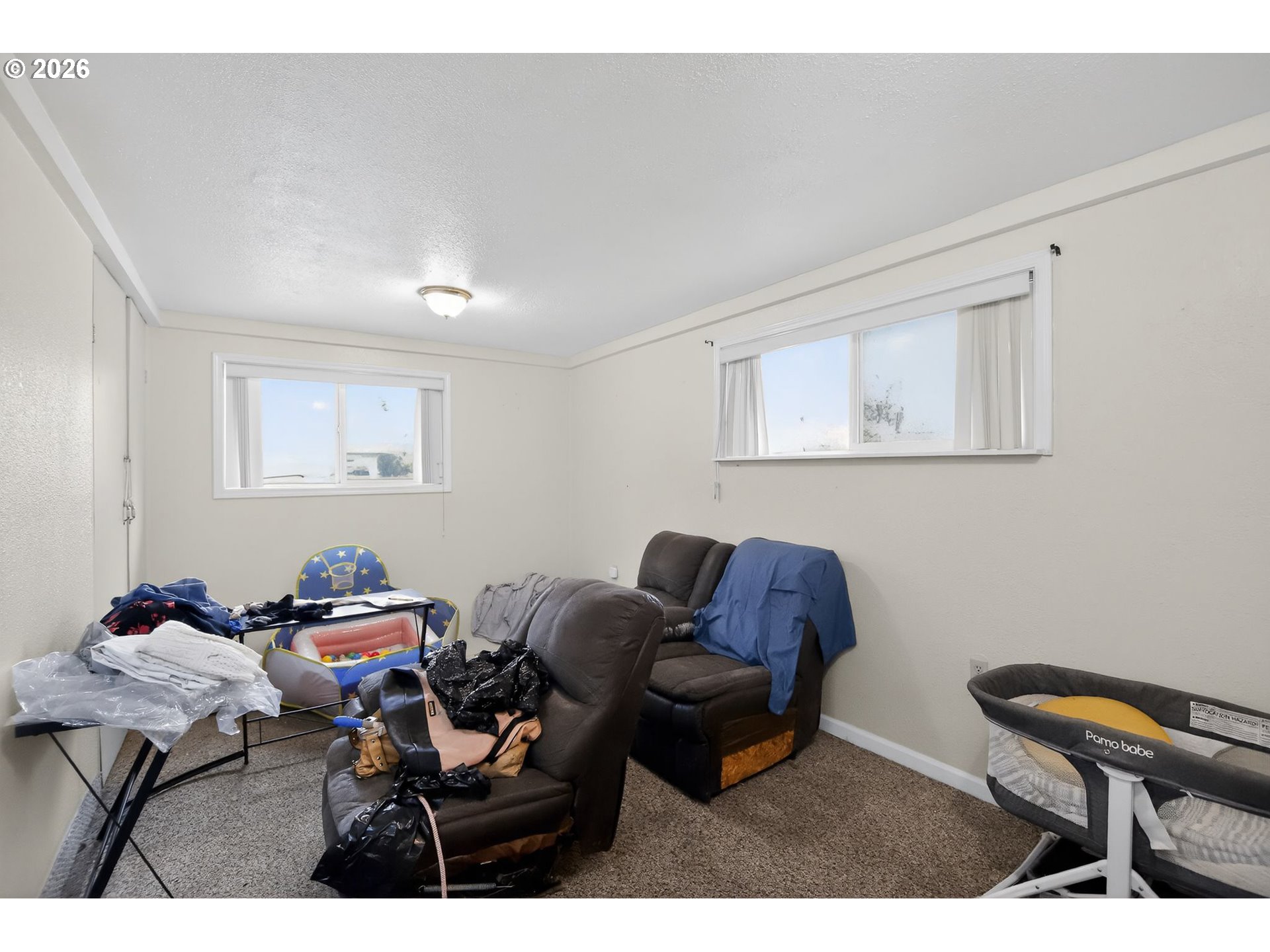 376 Northeast Chestnut Street Madras, OR 97741 - Photo 7 of 26 a living room with furniture and a chair