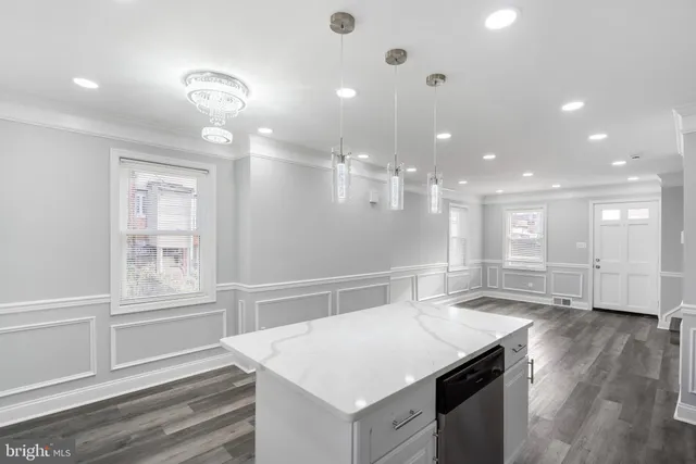 a view of a kitchen cabinets and wooden floor