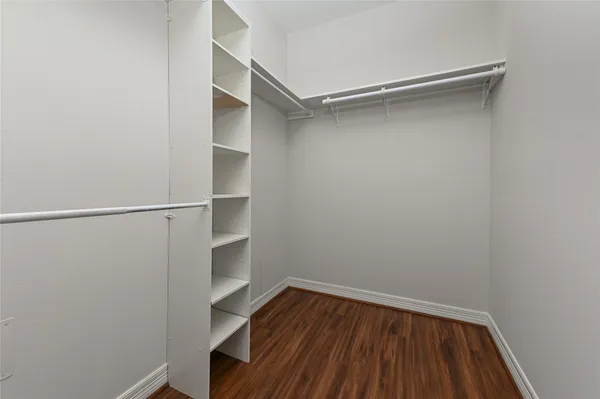 a view of an empty walk in closet