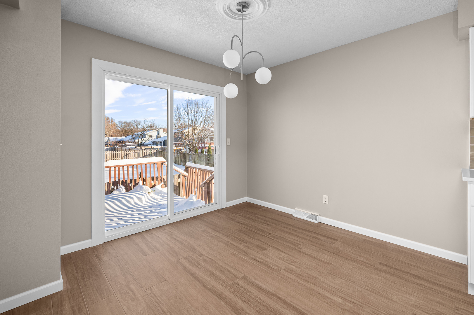 5302 16th Avenue Moline, IL 61265 - Photo 11 of 34 a view of an empty room with wooden floor and a window
