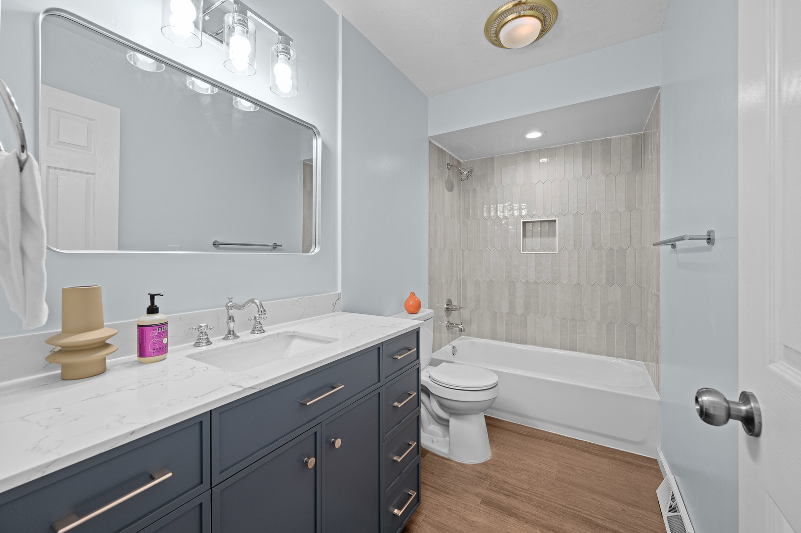 5302 16th Avenue Moline, IL 61265 - Photo 15 of 34 a bathroom with a sink a toilet and shower