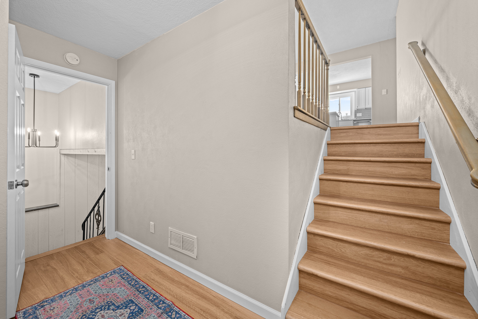 5302 16th Avenue Moline, IL 61265 - Photo 20 of 34 a view of a hallway with wooden floor and staircase