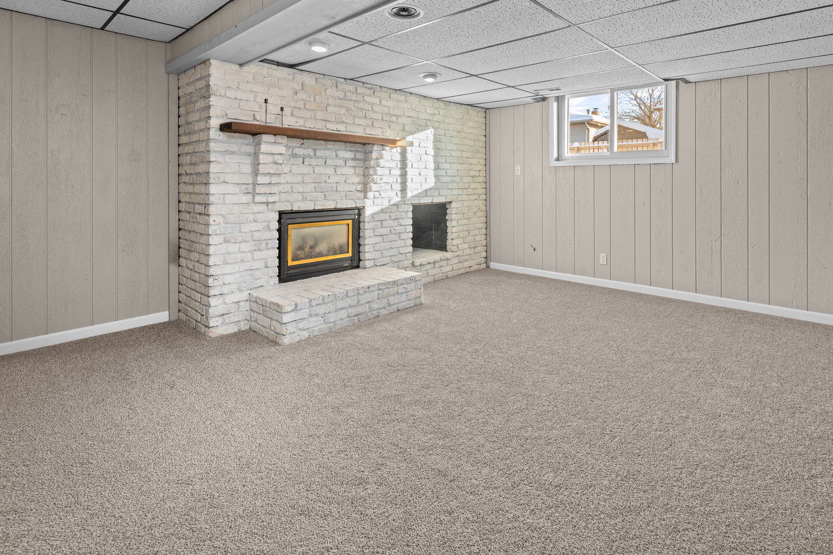5302 16th Avenue Moline, IL 61265 - Photo 24 of 34 a view of an empty room with a fireplace and a window