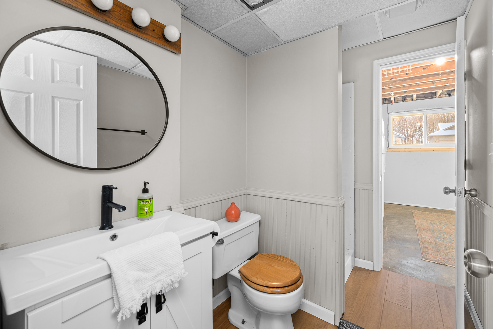 5302 16th Avenue Moline, IL 61265 - Photo 31 of 34 a bathroom with a sink toilet and a mirror