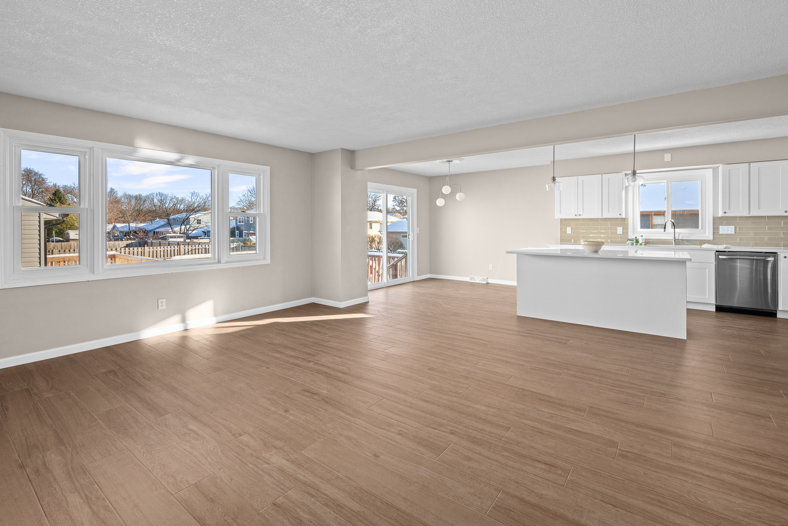 5302 16th Avenue Moline, IL 61265 - Photo 4 of 34 a view of a kitchen with wooden floor and a window
