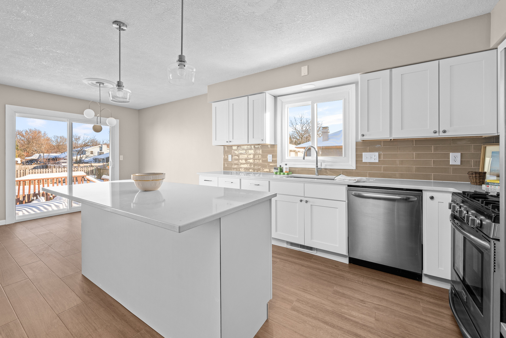 5302 16th Avenue Moline, IL 61265 - Photo 10 of 34 a kitchen with a sink window and stainless steel appliances