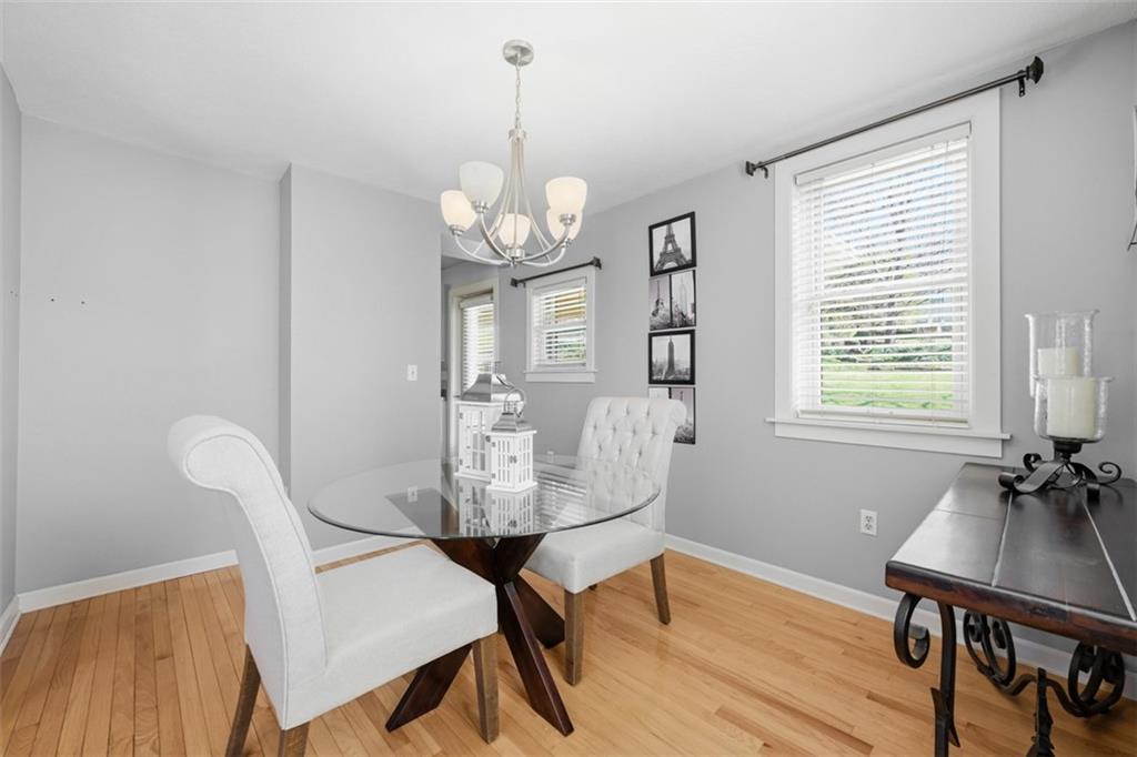 252 Berry Street Baden, PA 15005 - Photo 11 of 48 a view of a dining room with furniture window and wooden floor