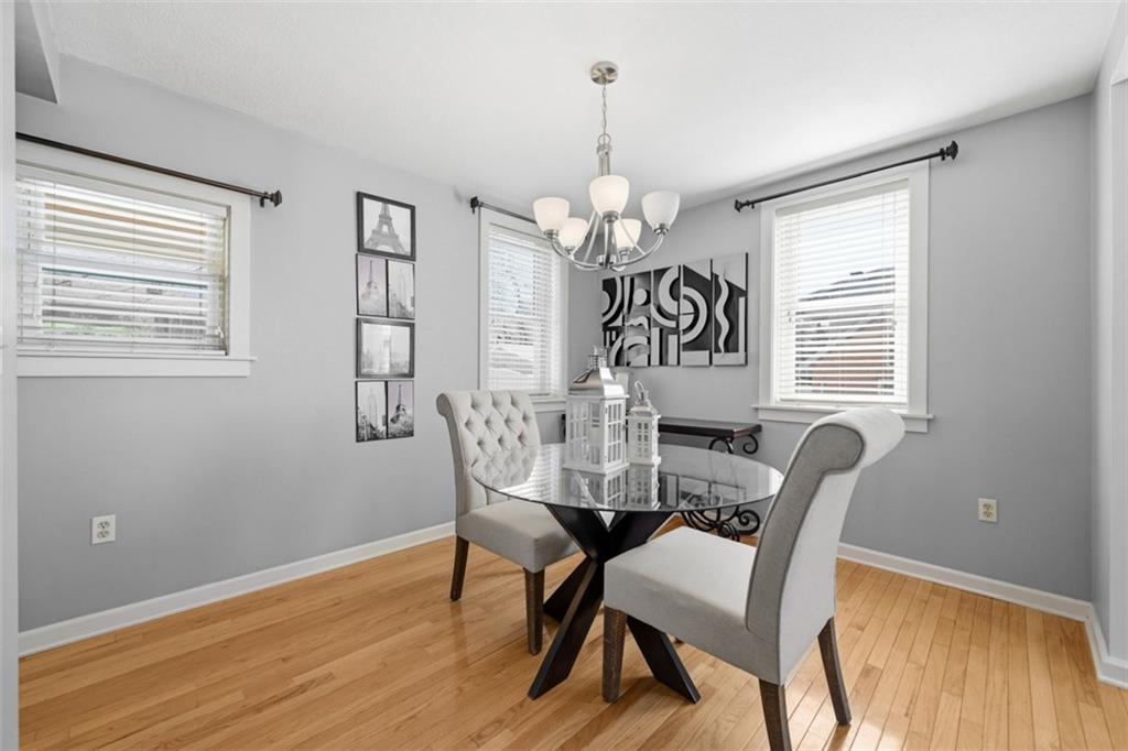 252 Berry Street Baden, PA 15005 - Photo 12 of 48 a view of a dining room with furniture window and wooden floor