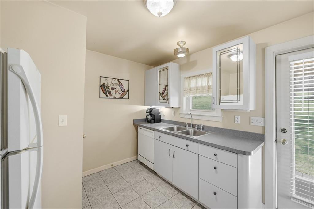 252 Berry Street Baden, PA 15005 - Photo 16 of 48 a kitchen with a sink and a window