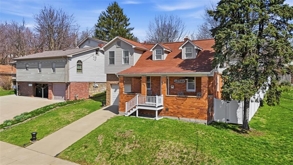 252 Berry Street Baden, PA 15005 - Photo 2 of 48 a front view of a house with a yard