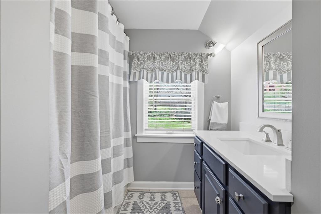 252 Berry Street Baden, PA 15005 - Photo 30 of 48 a bathroom with a sink a double vanity and a shower