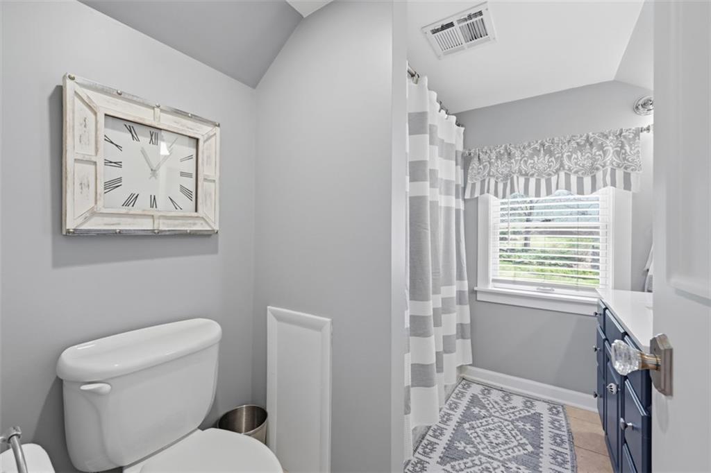 252 Berry Street Baden, PA 15005 - Photo 31 of 48 a white toilet sitting next to a window in a bathroom