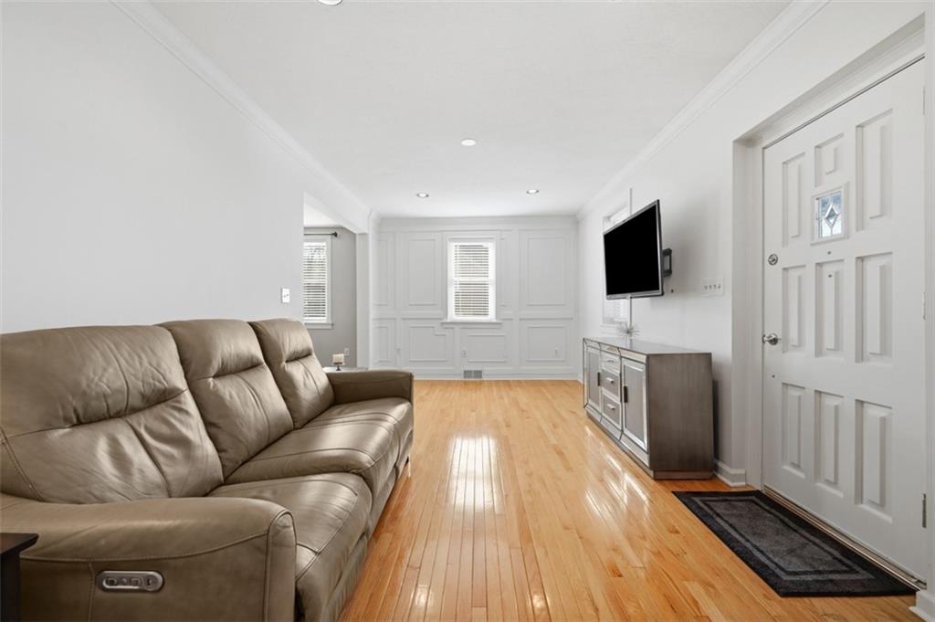 252 Berry Street Baden, PA 15005 - Photo 5 of 48 a living room with furniture and a flat screen tv