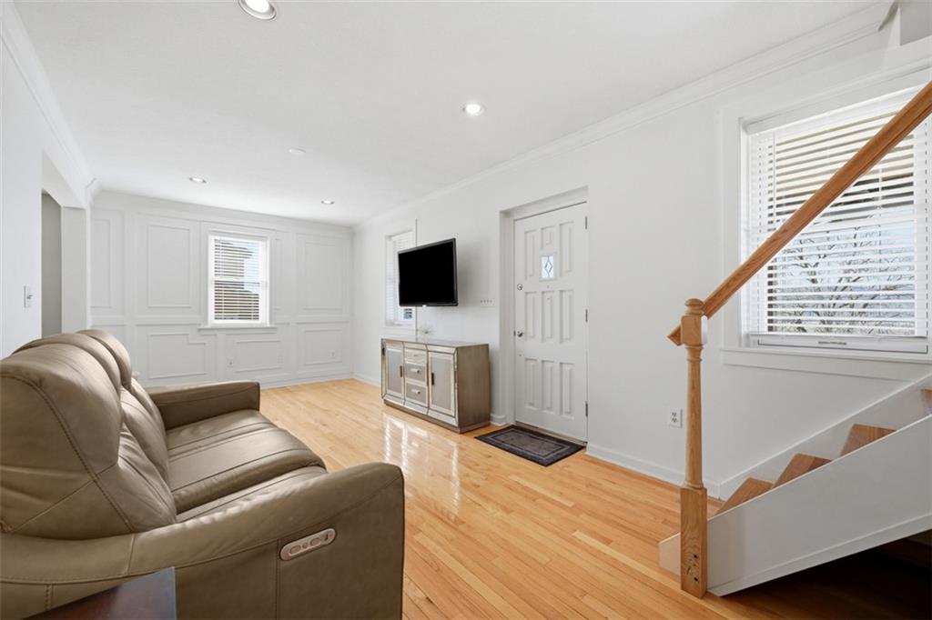 252 Berry Street Baden, PA 15005 - Photo 6 of 48 a living room with furniture and a flat screen tv