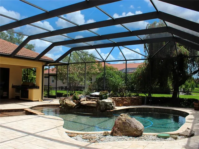 a living room with a table and wooden floor