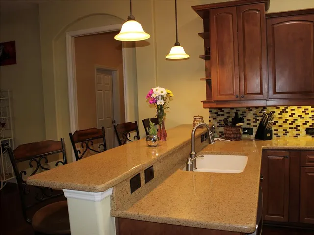 a bath tub sitting in a bathroom next to a window