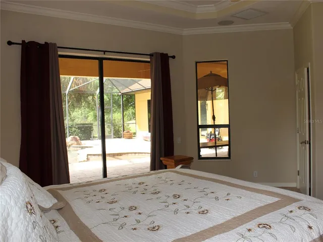 a bedroom with a bed and a lamp