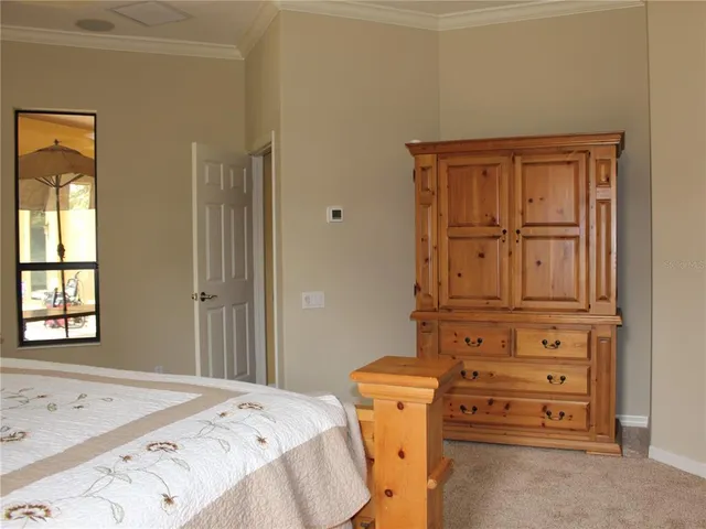 a view of a workspace with a window and chair