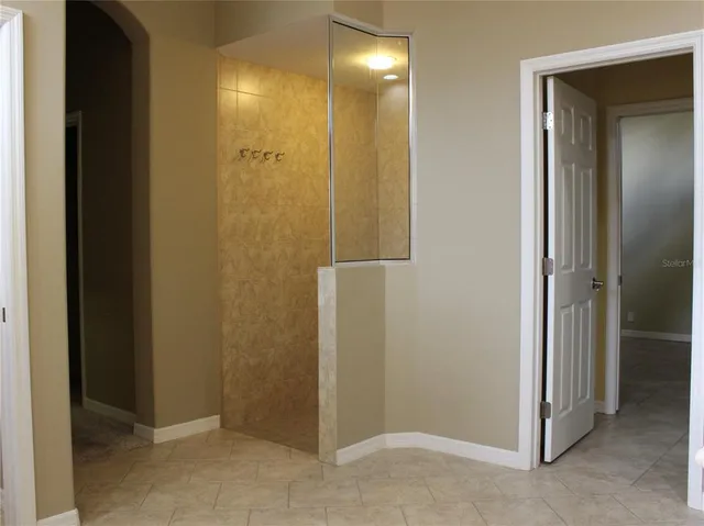 a bathroom with a sink vanity and a mirror
