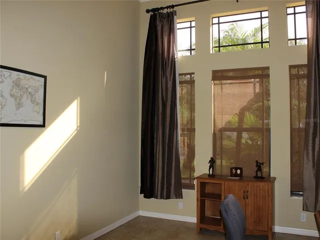 a patio with a table and chairs