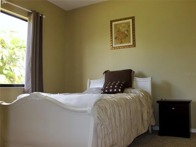 an aerial view of a house with garden space and sitting space