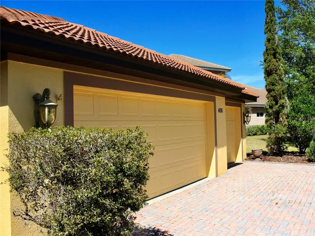 a view of backyard with swimming pool table and chairs