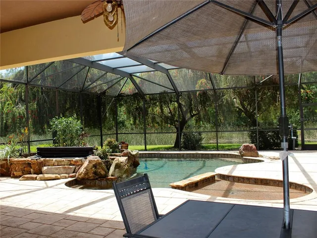 a view of a lake with a big yard