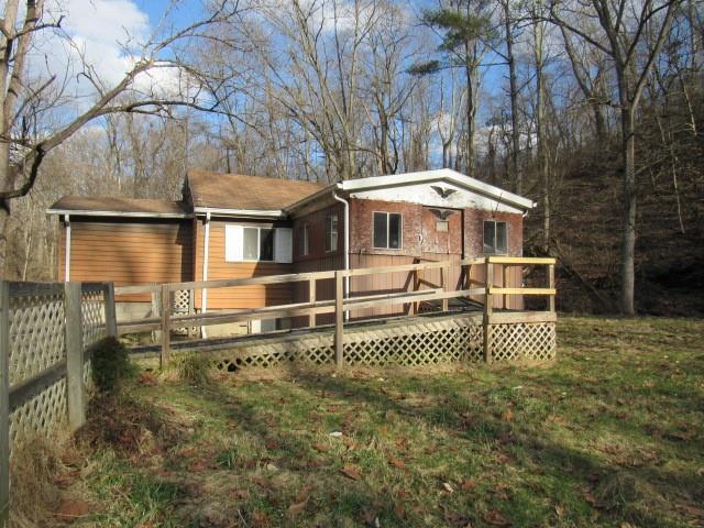 105 Raineytown Road Dawson, PA 15428 - Photo 3 of 18 a front view of a house with a garden