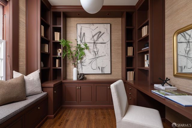 a view of a livingroom with furniture and a potted plant