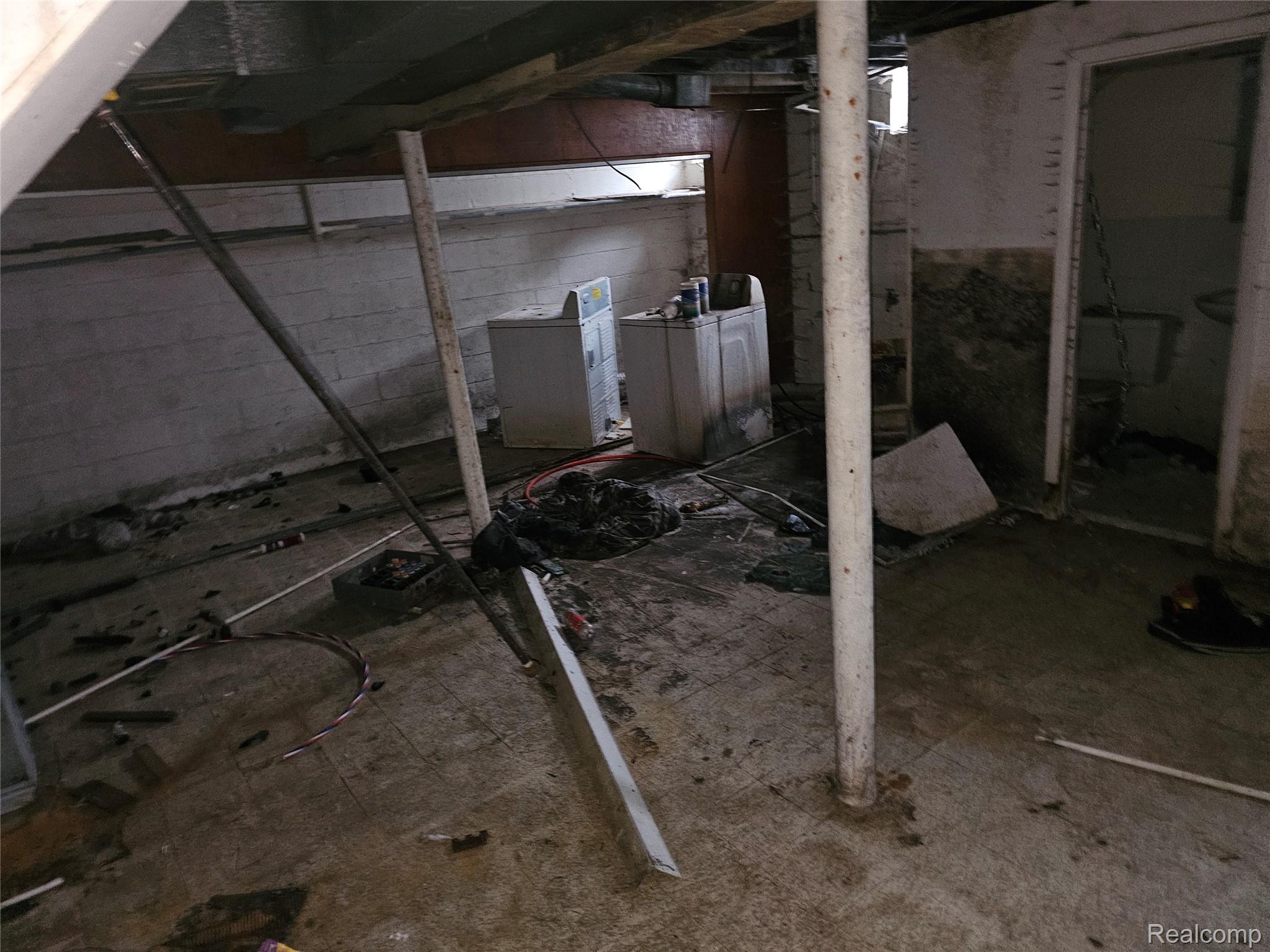 19442 Moross Road Detroit, MI 48224 - Photo 22 of 48 Unfinished basement with washer / dryer and drainage system