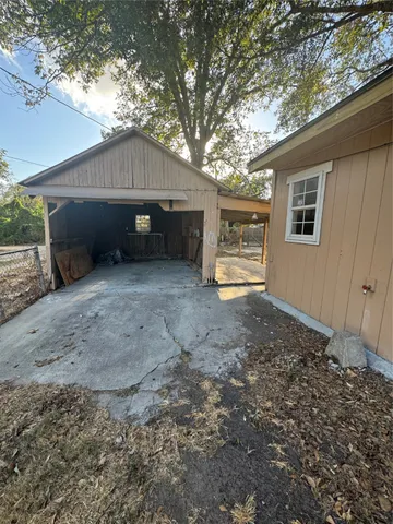a house view with a backyard space