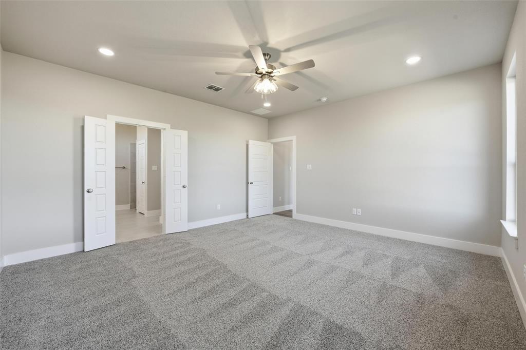 1973 Johnnie Drive Springtown, TX 76082 - Photo 23 of 38 Unfurnished bedroom featuring recessed lighting, light colored carpet, and a ceiling fan