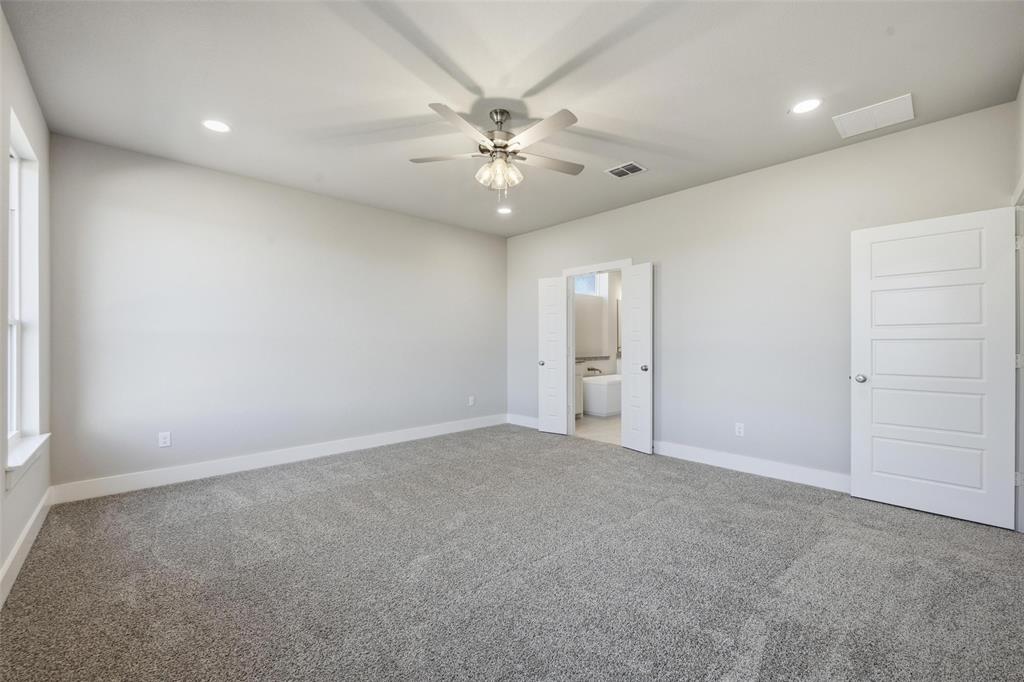 1973 Johnnie Drive Springtown, TX 76082 - Photo 26 of 38 Unfurnished bedroom featuring carpet, recessed lighting, a ceiling fan, and ensuite bath