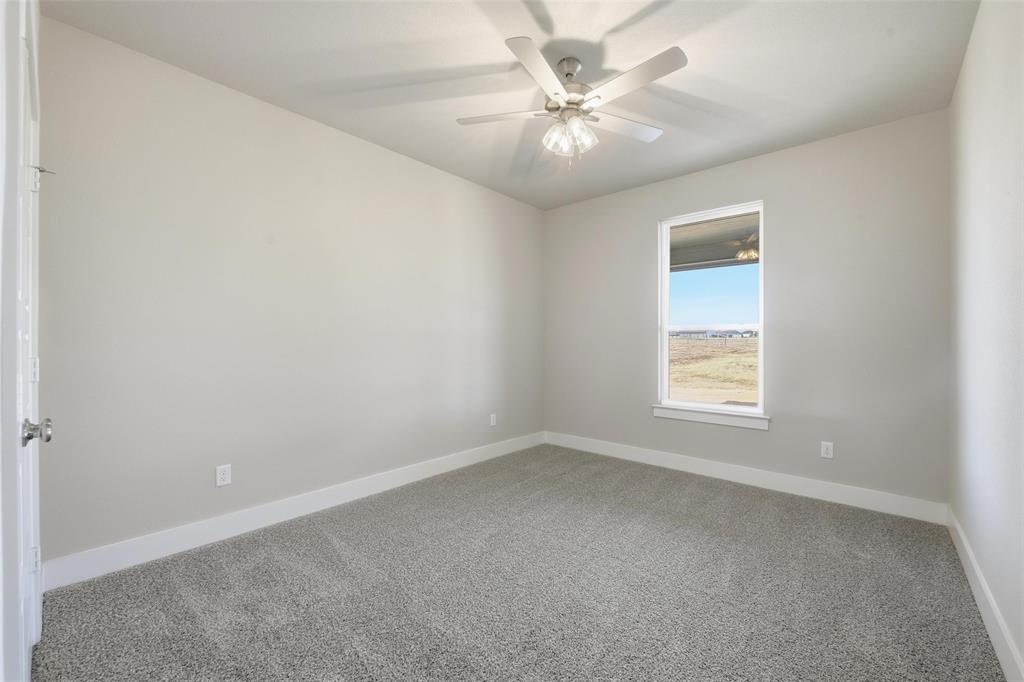 1973 Johnnie Drive Springtown, TX 76082 - Photo 28 of 38 Unfurnished room featuring carpet flooring and a ceiling fan