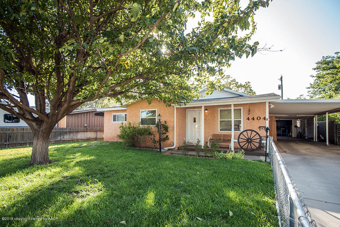 4404 South Hayden Street Amarillo, TX 79110 - Photo 1 of 29 a view of a house with backyard and a tree