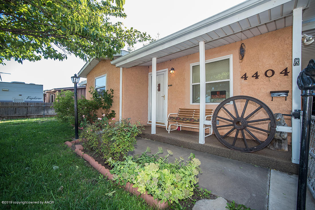 4404 South Hayden Street Amarillo, TX 79110 - Photo 2 of 29 a front view of a house with garden