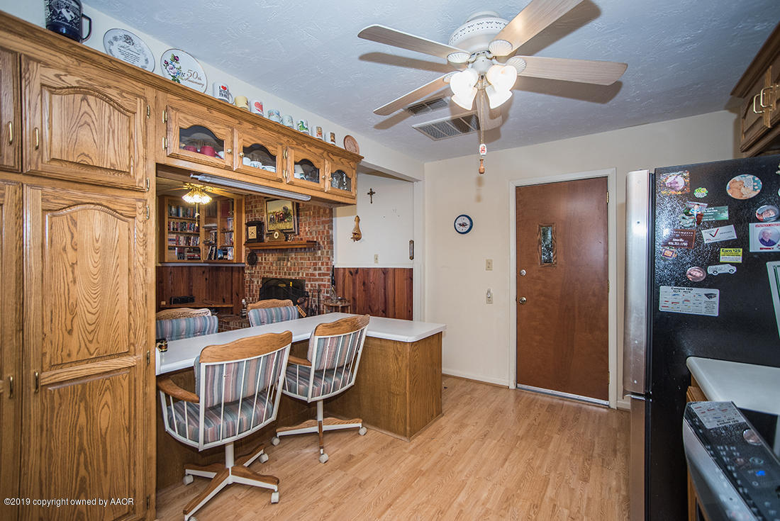 4404 South Hayden Street Amarillo, TX 79110 - Photo 11 of 29 a view of a room with furniture and wooden floor