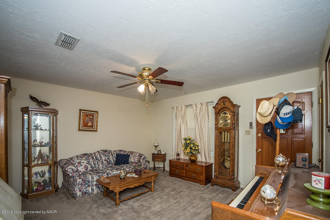 4404 South Hayden Street Amarillo, TX 79110 - Photo 13 of 29 a living room with furniture and wooden floor