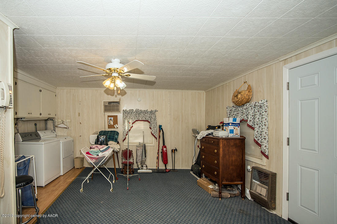 4404 South Hayden Street Amarillo, TX 79110 - Photo 24 of 29 a view of a workspace with furniture and a window