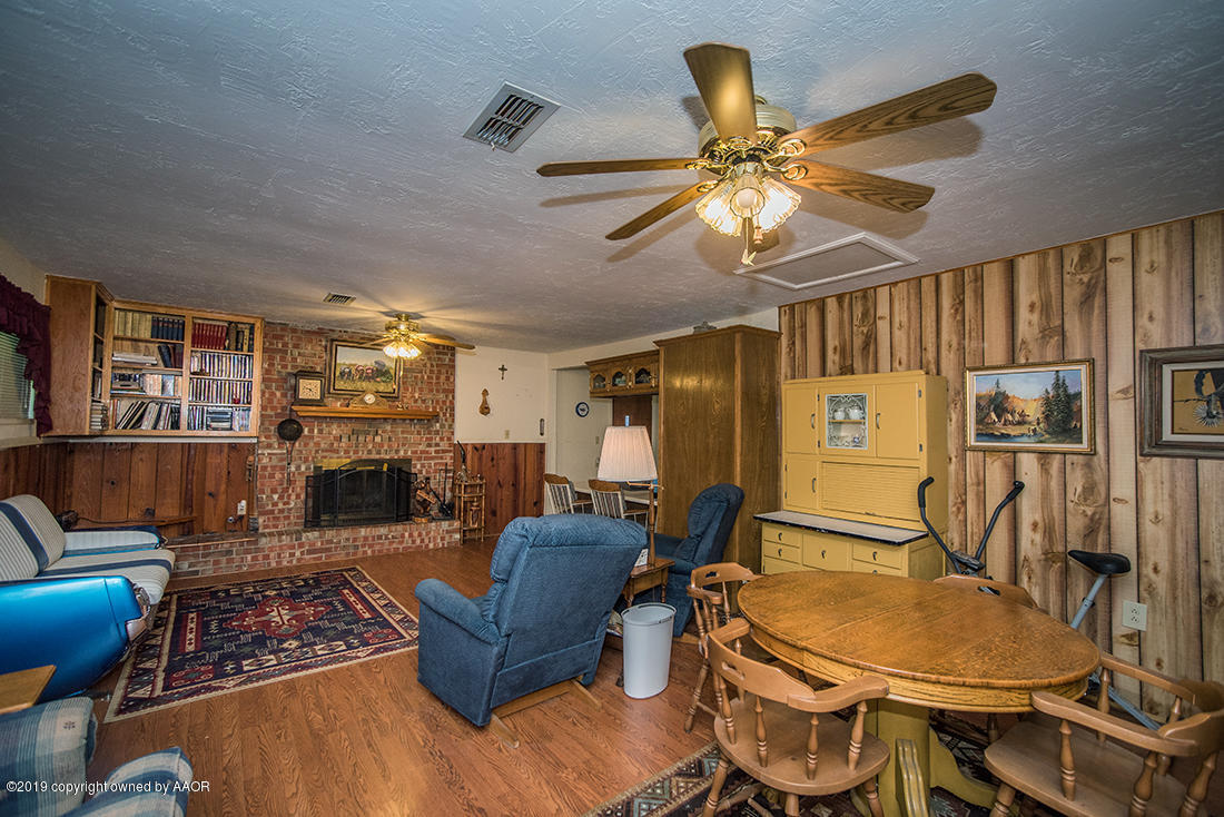 4404 South Hayden Street Amarillo, TX 79110 - Photo 7 of 29 a living room with furniture and a fireplace