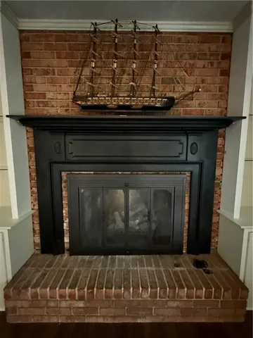a view of fireplace with wooden floor