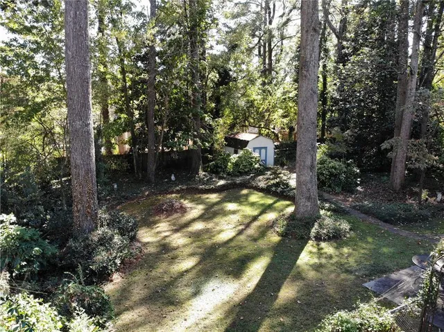 a backyard of a house with lots of green space