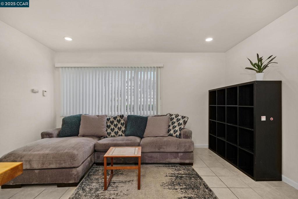 1926 Alcatraz Avenue Berkeley, CA 94703 - Photo 8 of 14 a living room with furniture and a rug