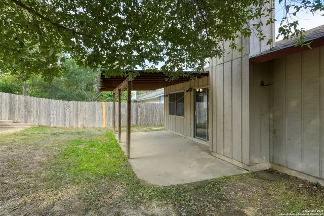 a house with a tree in the background