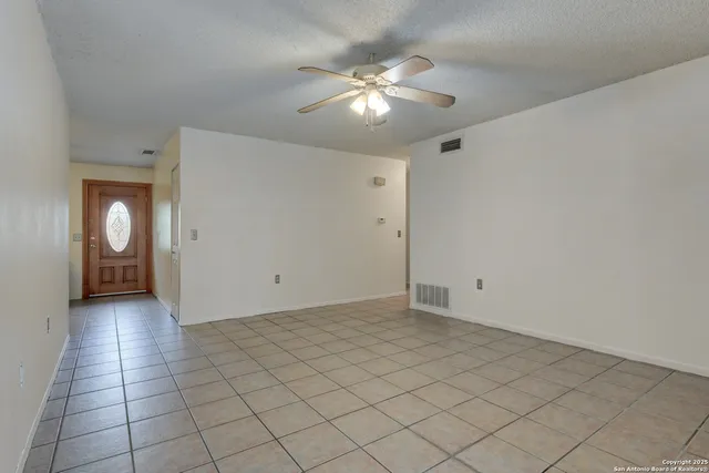 a kitchen with a stove and a refrigerator