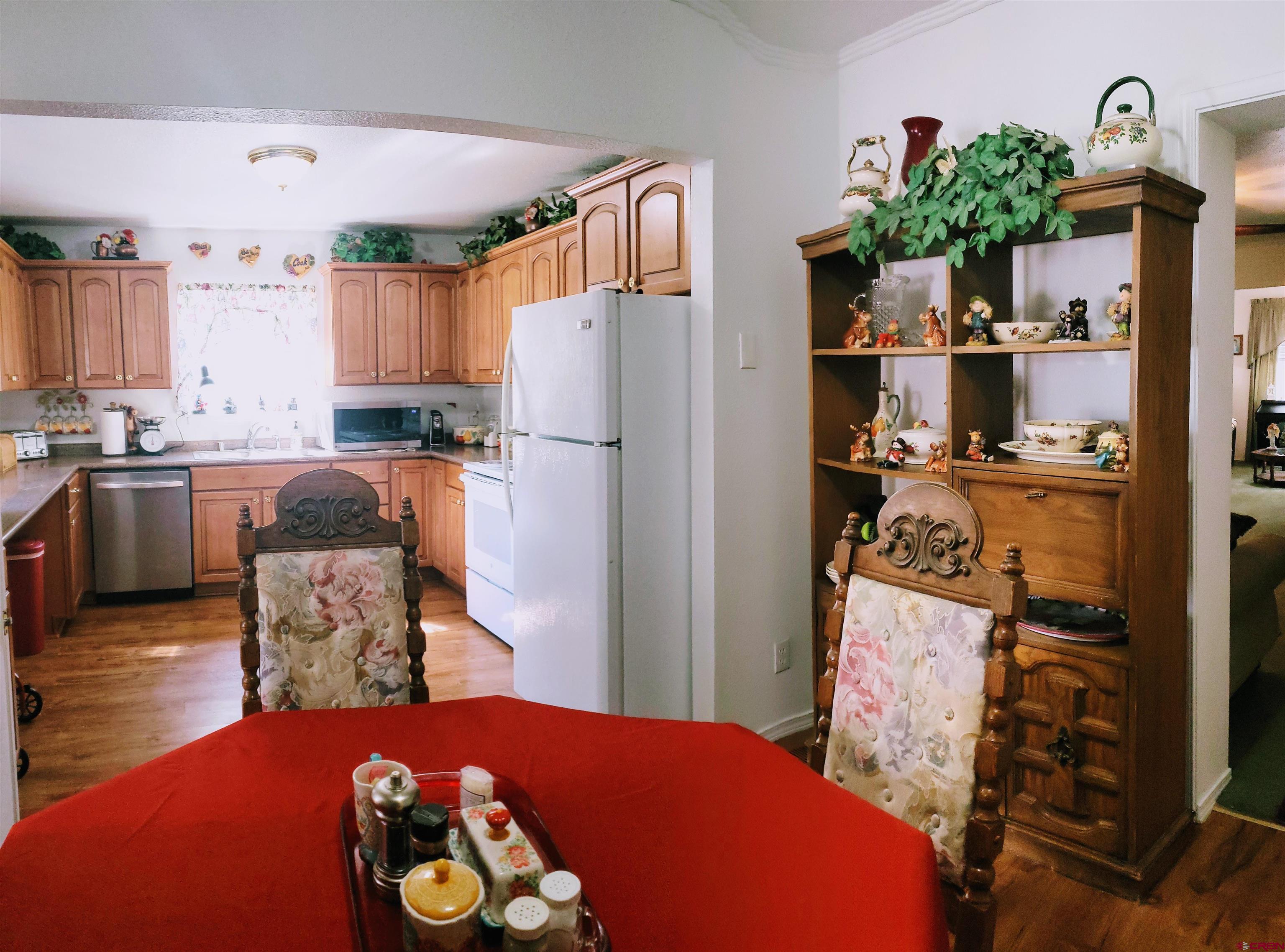 20915 Upland Road Cedaredge, CO 81413 - Photo 21 of 35 a kitchen with a refrigerator and a stove top oven