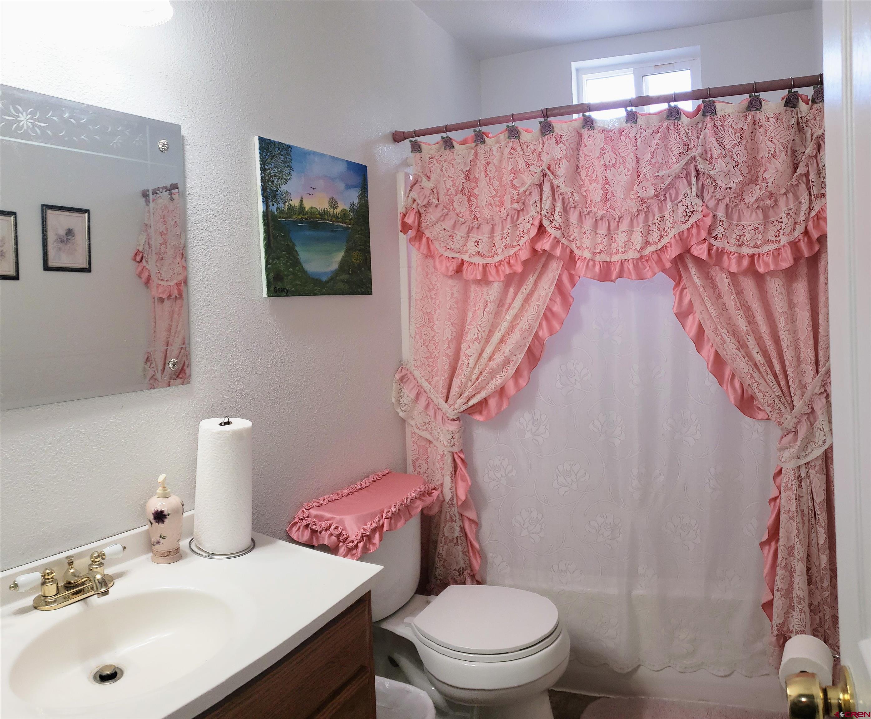 20915 Upland Road Cedaredge, CO 81413 - Photo 29 of 35 a bathroom with a sink and a toilet
