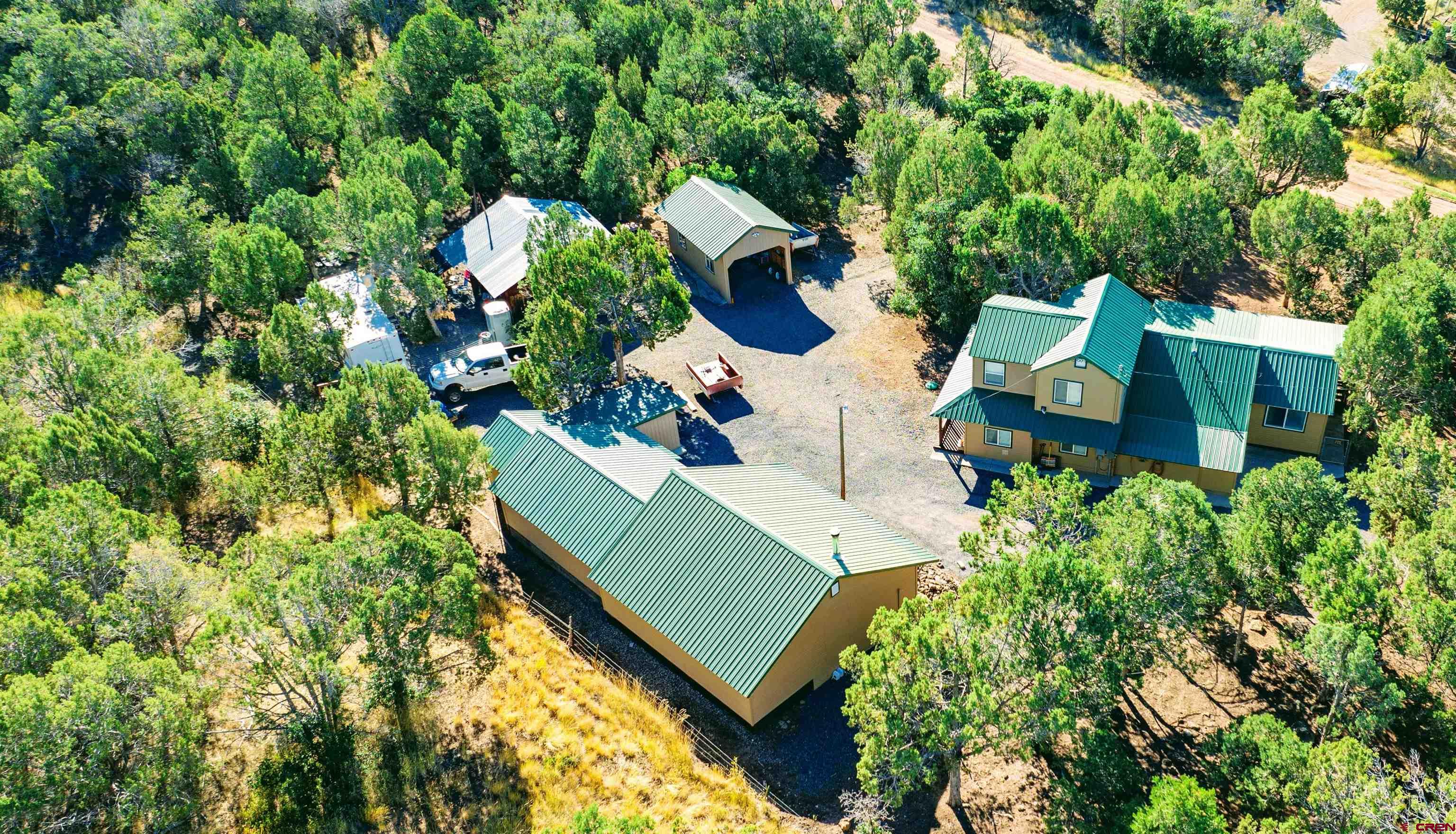 20915 Upland Road Cedaredge, CO 81413 - Photo 34 of 35 an aerial view of a house with a yard and garden