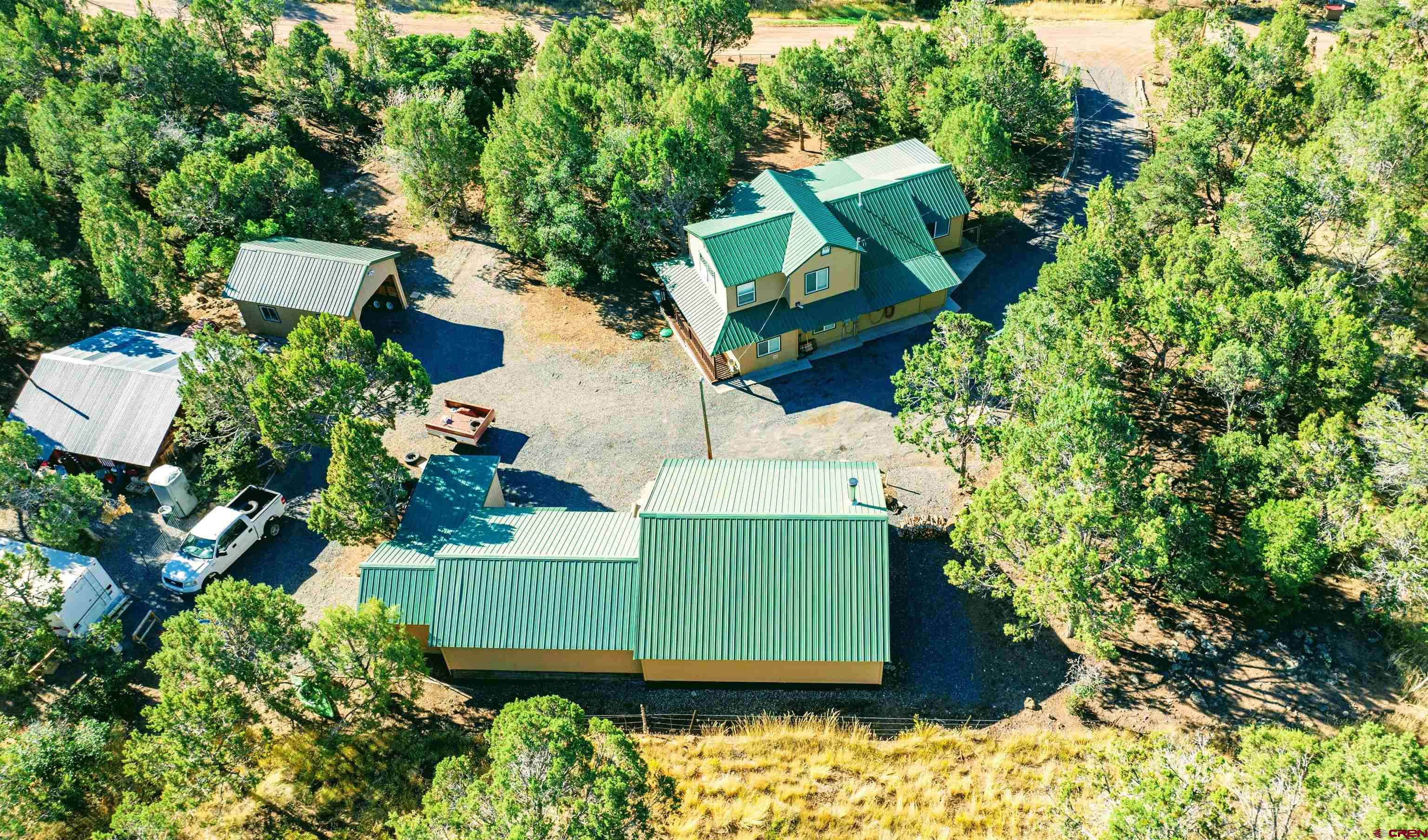 20915 Upland Road Cedaredge, CO 81413 - Photo 6 of 35 an aerial view of a house with a yard